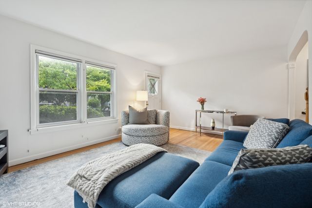 a bedroom with furniture and a window