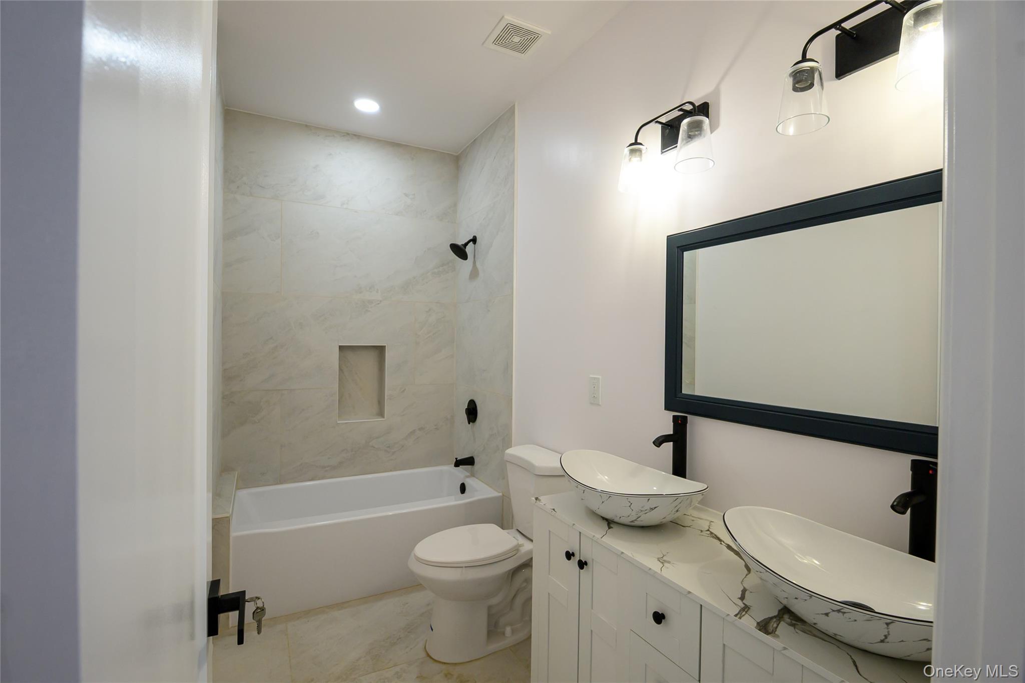 81 Silver Lake Sctn Road Middletown, NY 10940 - Photo 28 of 37 a bathroom with a granite countertop sink toilet and shower