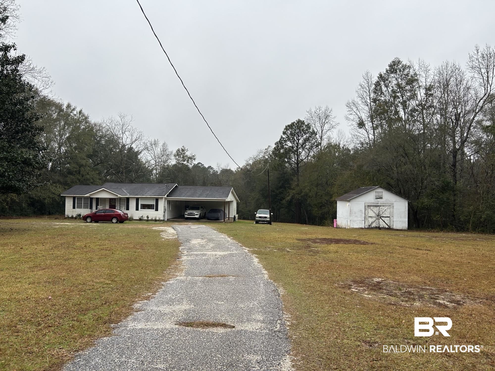 3850 Newman Road Mobile, AL 36695 - Photo 2 of 27 View of front facade with a front yard and an outdoor structure