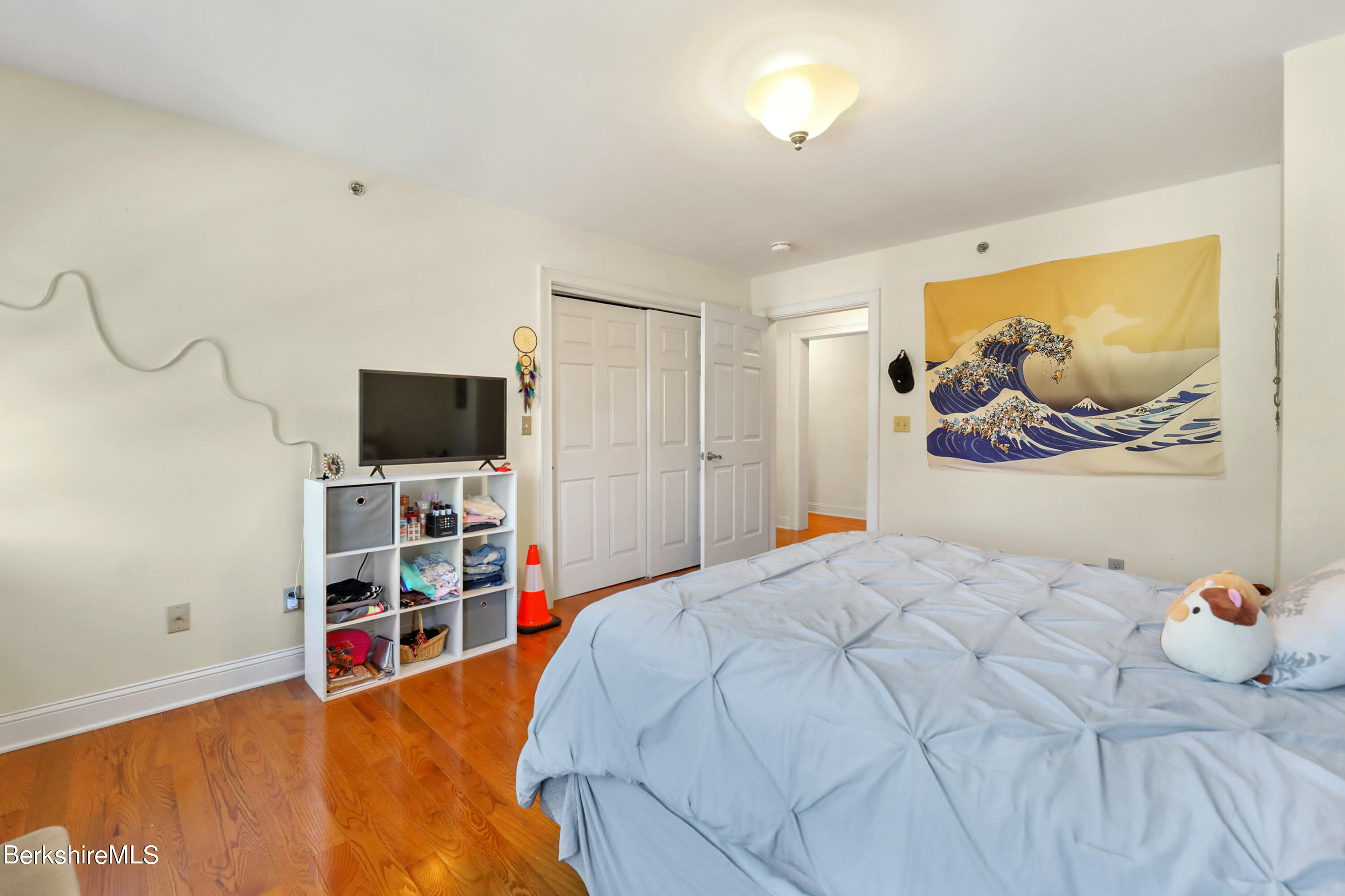 29 Main Street West Stockbridge, MA 01266 - Photo 45 of 51 a bedroom with a bed and a flat screen tv