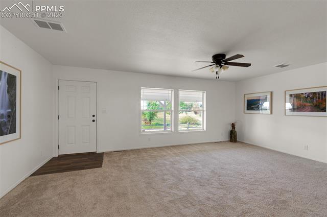 22750 Handle Road Calhan, CO 80808 - Photo 6 of 34 Living Room and bedrooms all furnished with fans. This home has central air conditioning.