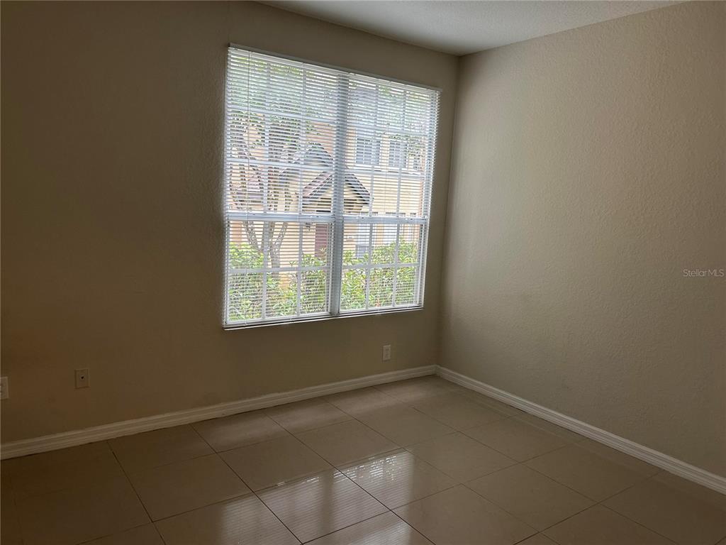 6308 Raleigh Street, Unit 303 Orlando, FL 32835 - Photo 9 of 14 a view of a room that has a window in it