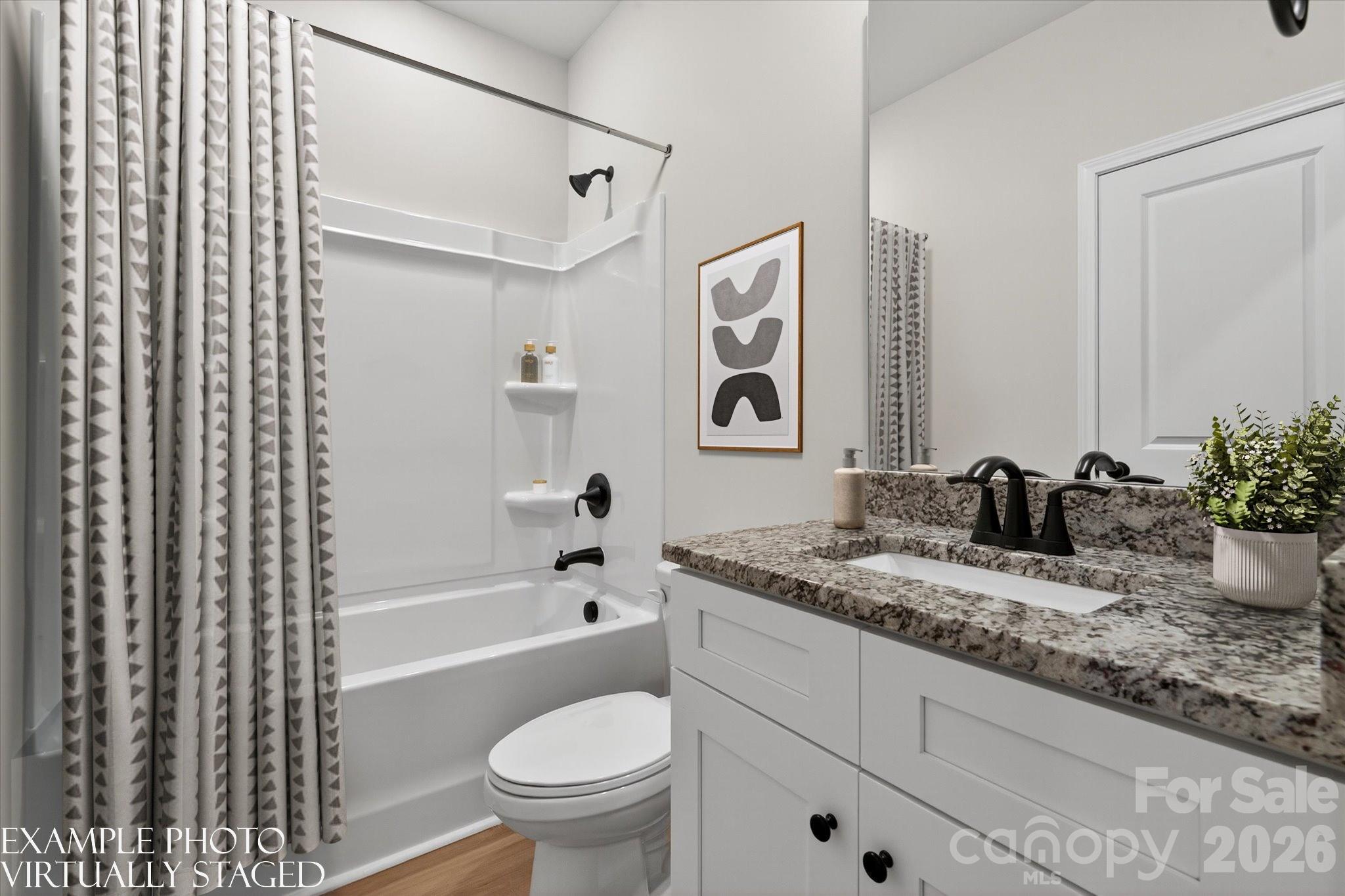 1229 Signal Street Gastonia, NC 28052 - Photo 4 of 14 a bathroom with a granite countertop sink and a mirror
