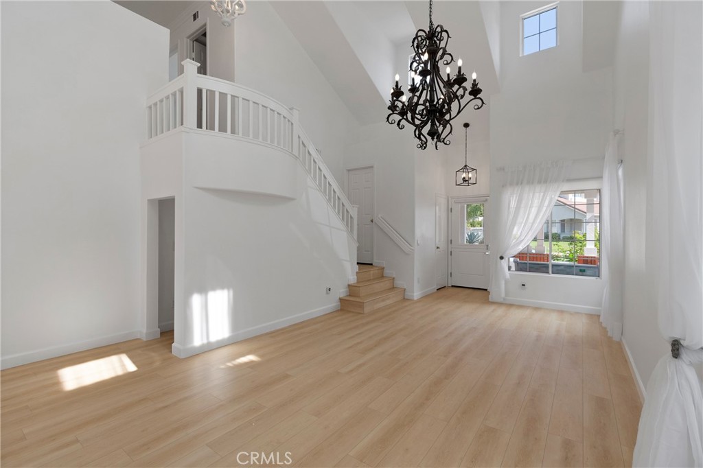 22 Carriage Drive Lake Forest, CA 92610 - Photo 13 of 35 wooden floor in an empty room with a window
