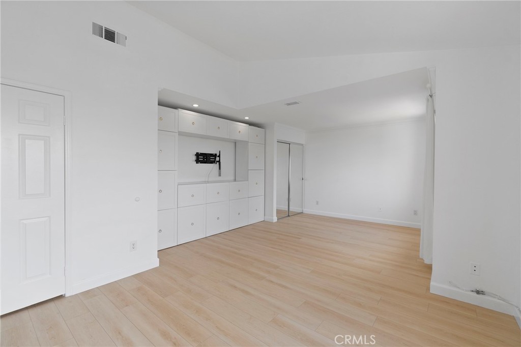 22 Carriage Drive Lake Forest, CA 92610 - Photo 17 of 35 a view of empty room with wooden floor