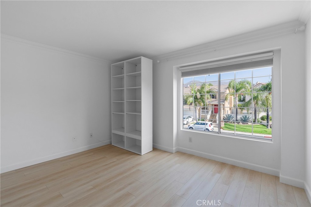 22 Carriage Drive Lake Forest, CA 92610 - Photo 18 of 35 an empty room with wooden floor and windows