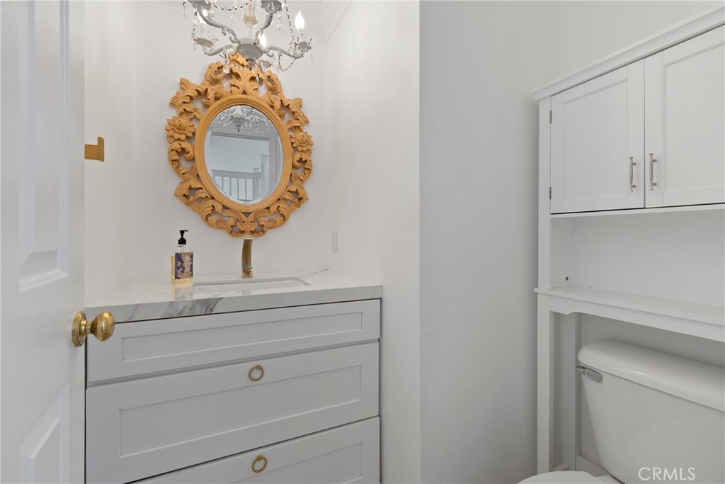 22 Carriage Drive Lake Forest, CA 92610 - Photo 22 of 35 a bathroom with a sink and a mirror