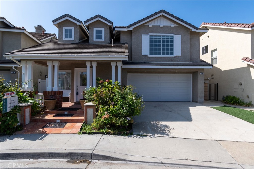 22 Carriage Drive Lake Forest, CA 92610 - Photo 34 of 35 a front view of a house with a yard garage and outdoor seating