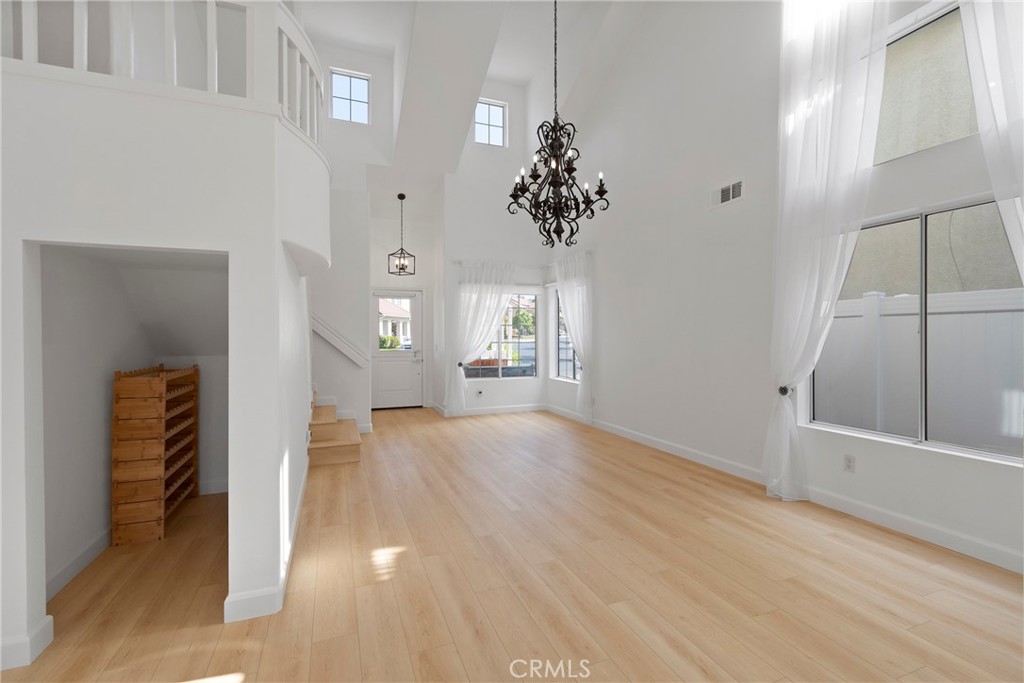 22 Carriage Drive Lake Forest, CA 92610 - Photo 4 of 35 wooden floor in an empty room with a window