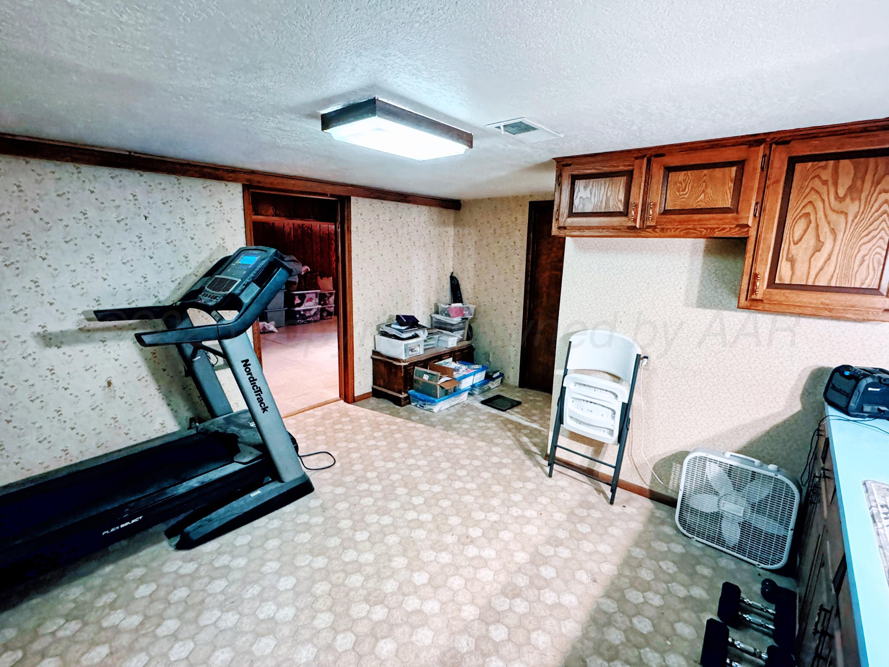 14490 County Road 24 Perryton, TX 79070 - Photo 14 of 28 a bedroom with furniture and a window