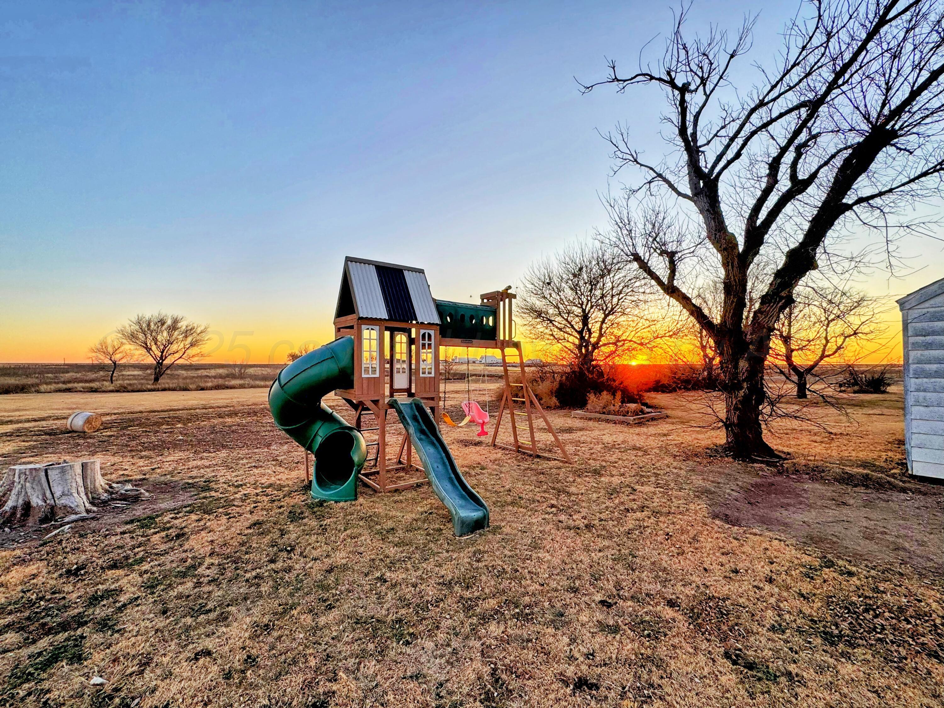 14490 County Road 24 Perryton, TX 79070 - Photo 20 of 28 a view of outdoor space with playground and green space