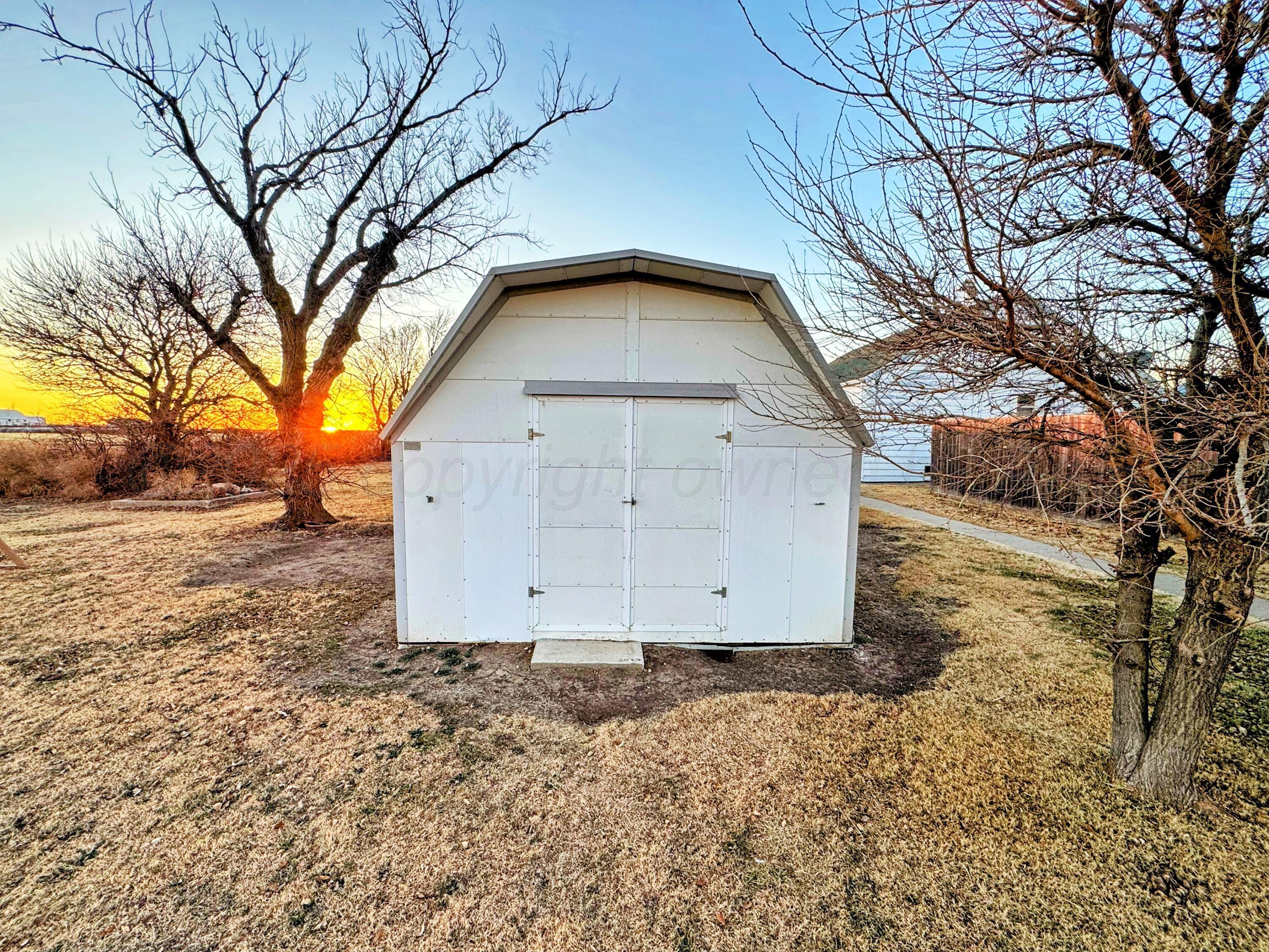14490 County Road 24 Perryton, TX 79070 - Photo 21 of 28 a view of a house with a yard