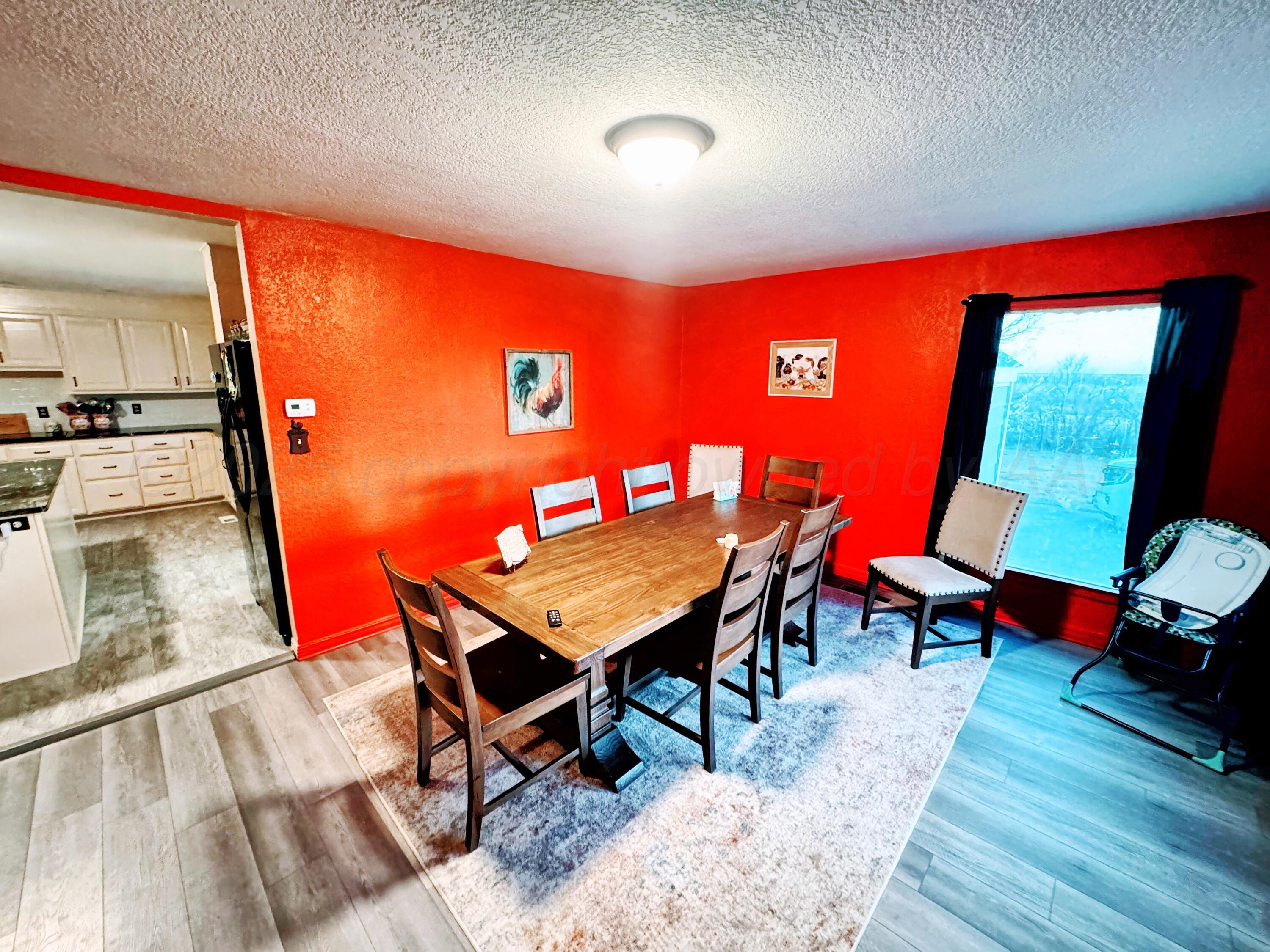 14490 County Road 24 Perryton, TX 79070 - Photo 5 of 28 a room with furniture pool table wooden floor and a table