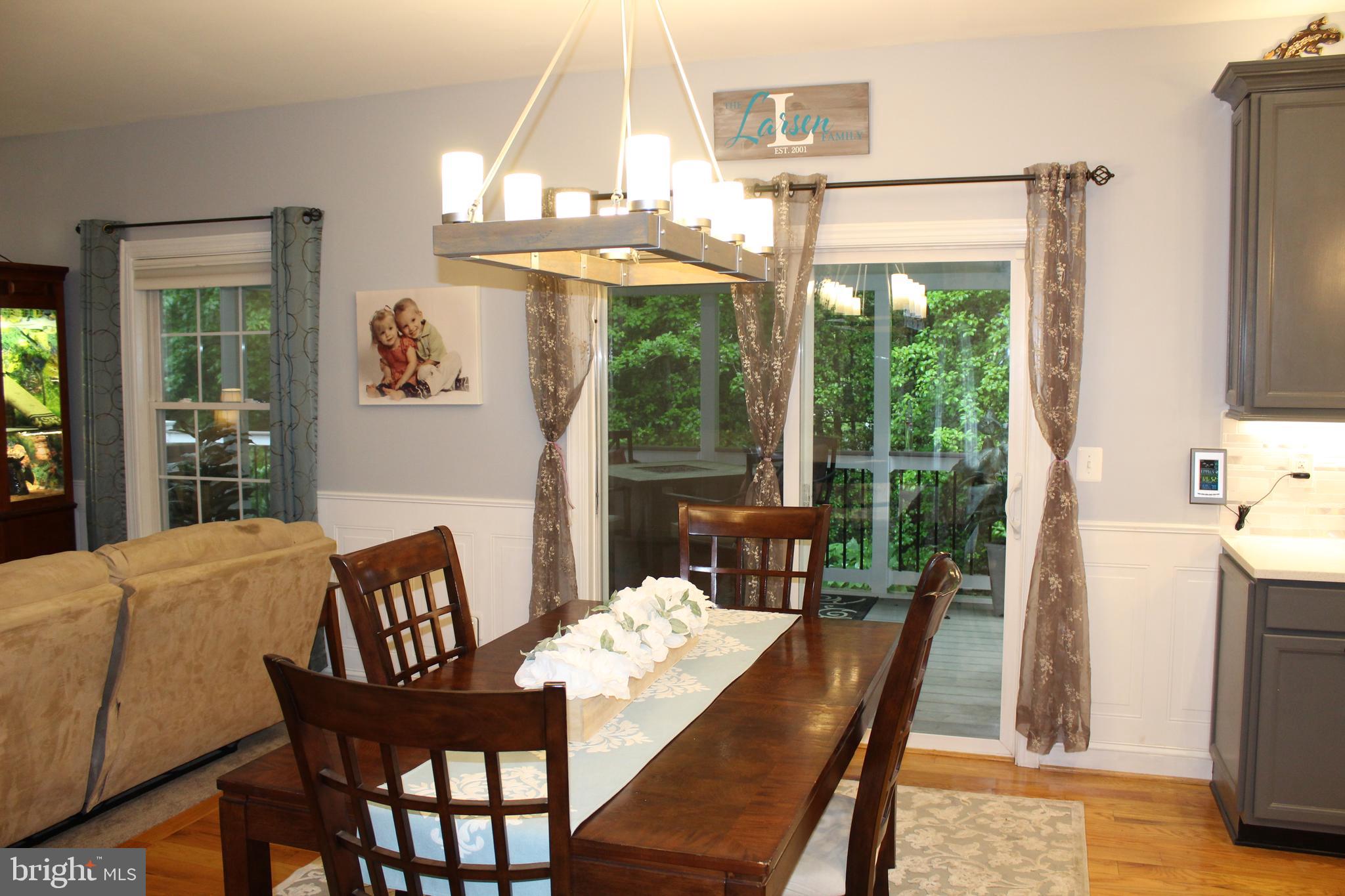 214 Featherstone Road Pasadena, MD 21122 - Photo 14 of 72 Sliders that open up to a huge screened in sun rm