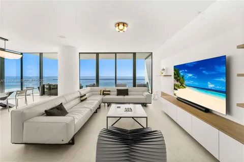 a view of an outdoor dining space with furniture and window
