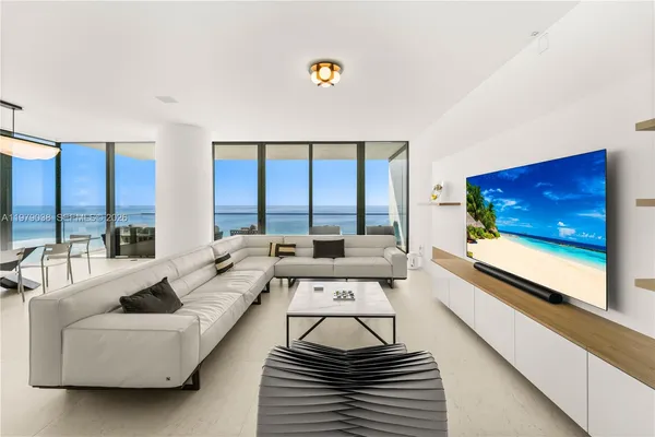 a view of an outdoor dining space with furniture and window