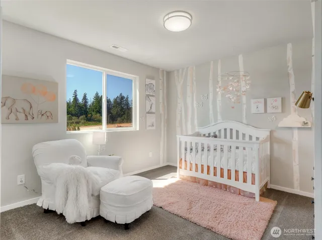 a bedroom with furniture and a window