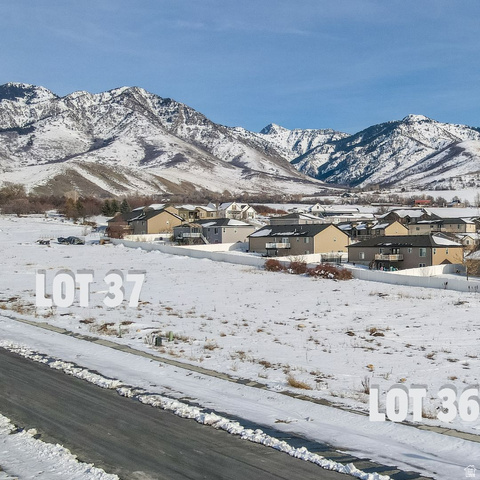 636 Cherry Ridge Lane, Unit 36 Richmond, UT 84333 - Photo 6 of 6 View of mountain backdrop featuring nearby suburban area