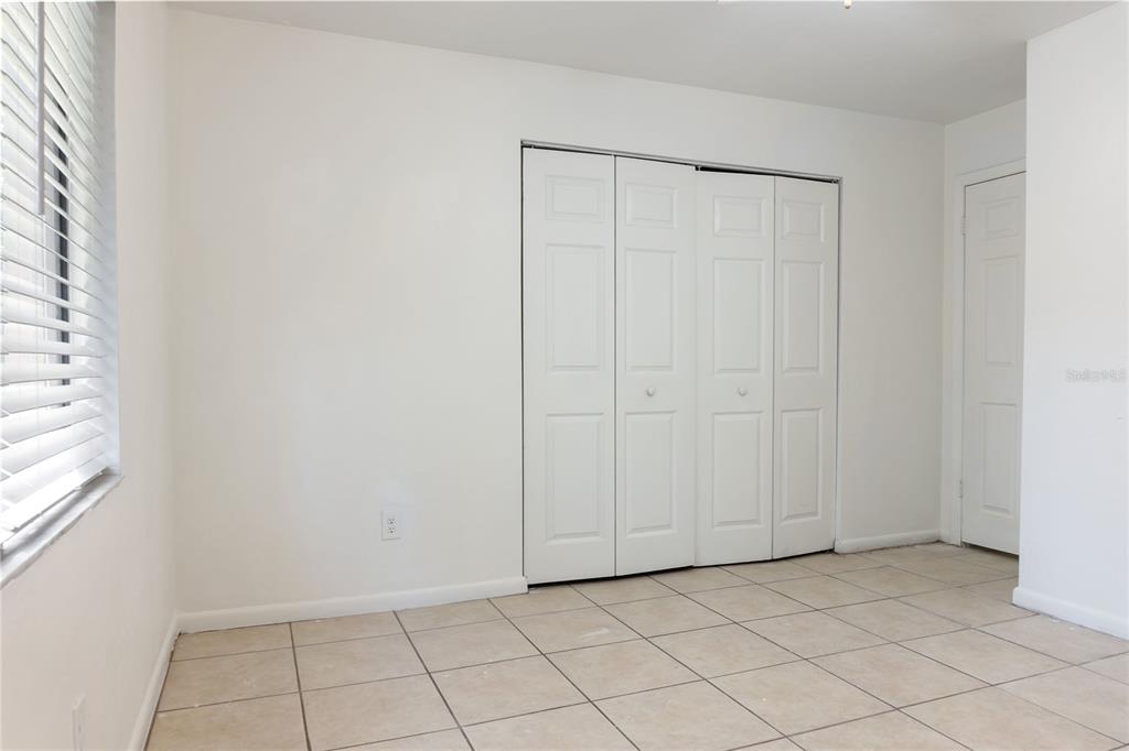1031 Southwest 61st Street Gainesville, FL 32607 - Photo 10 of 17 an empty room with white cabinet