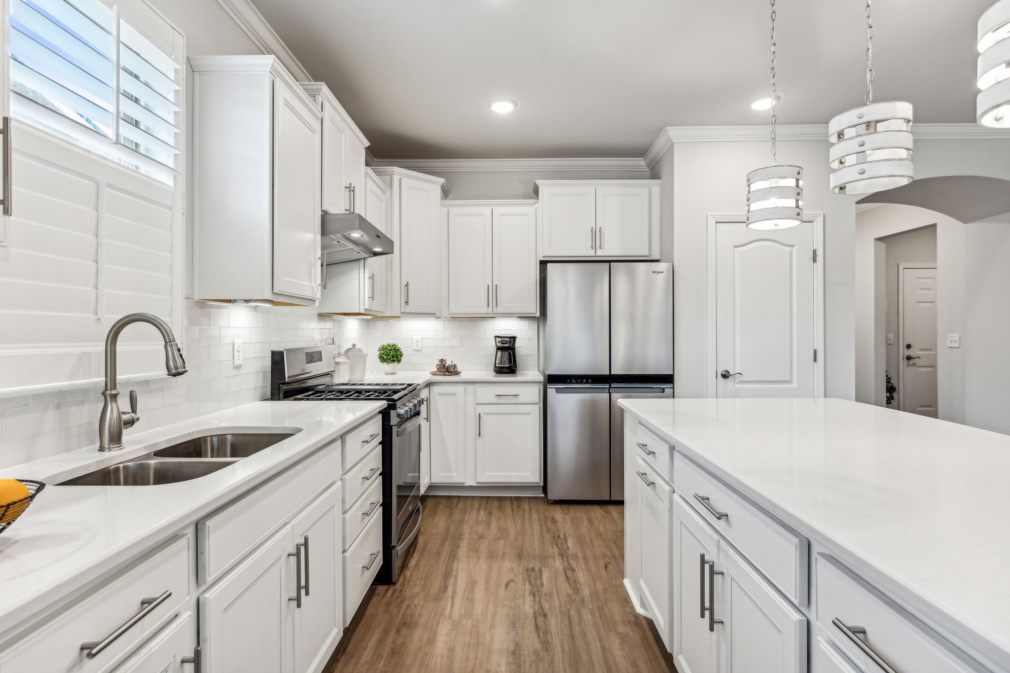 1062 Sumner Grove Spring Hill, TN 37174 - Photo 11 of 44 a kitchen with a sink white cabinets and stainless steel appliances