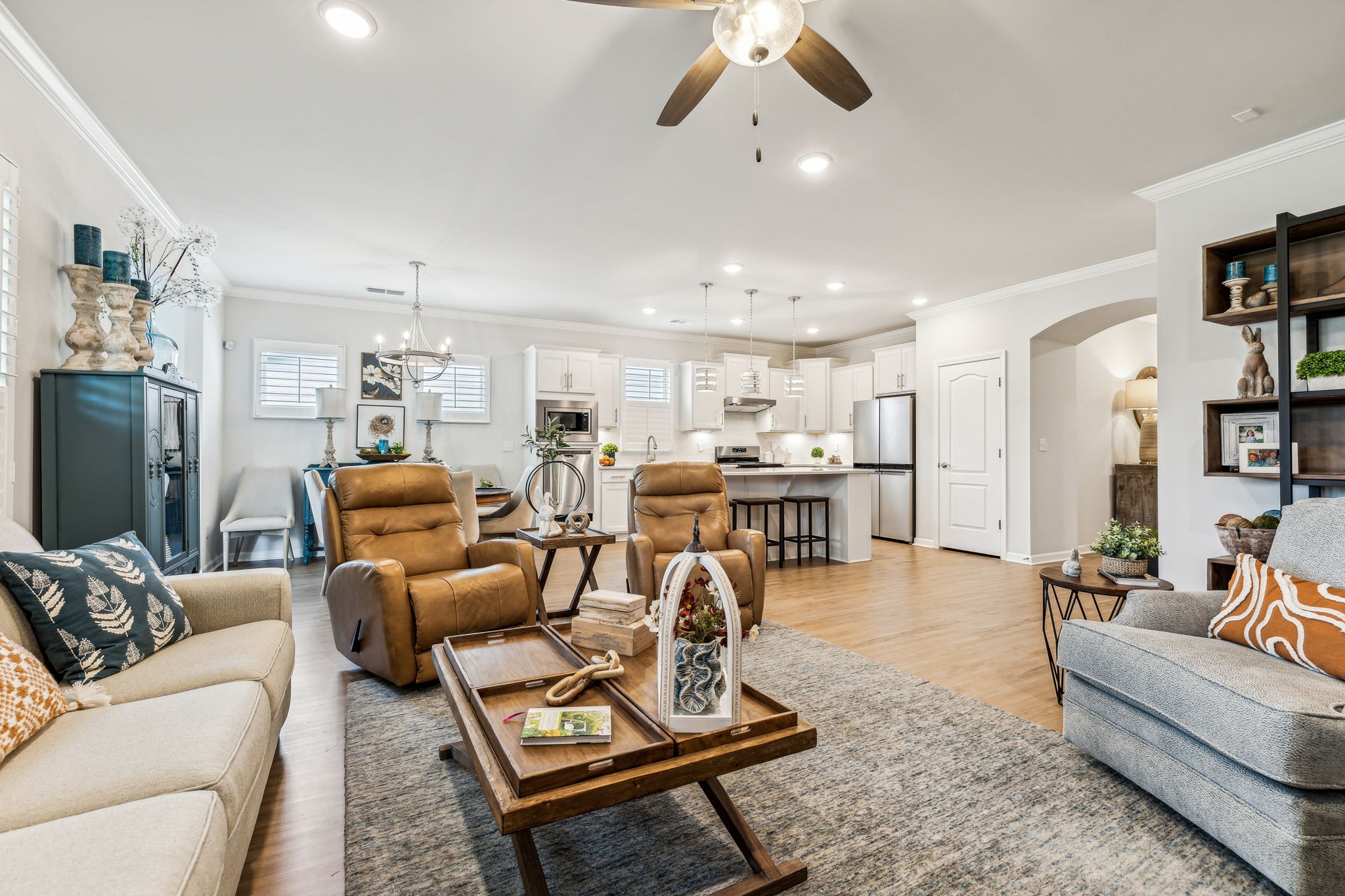 1062 Sumner Grove Spring Hill, TN 37174 - Photo 18 of 44 a living room with furniture kitchen view and a flat screen tv