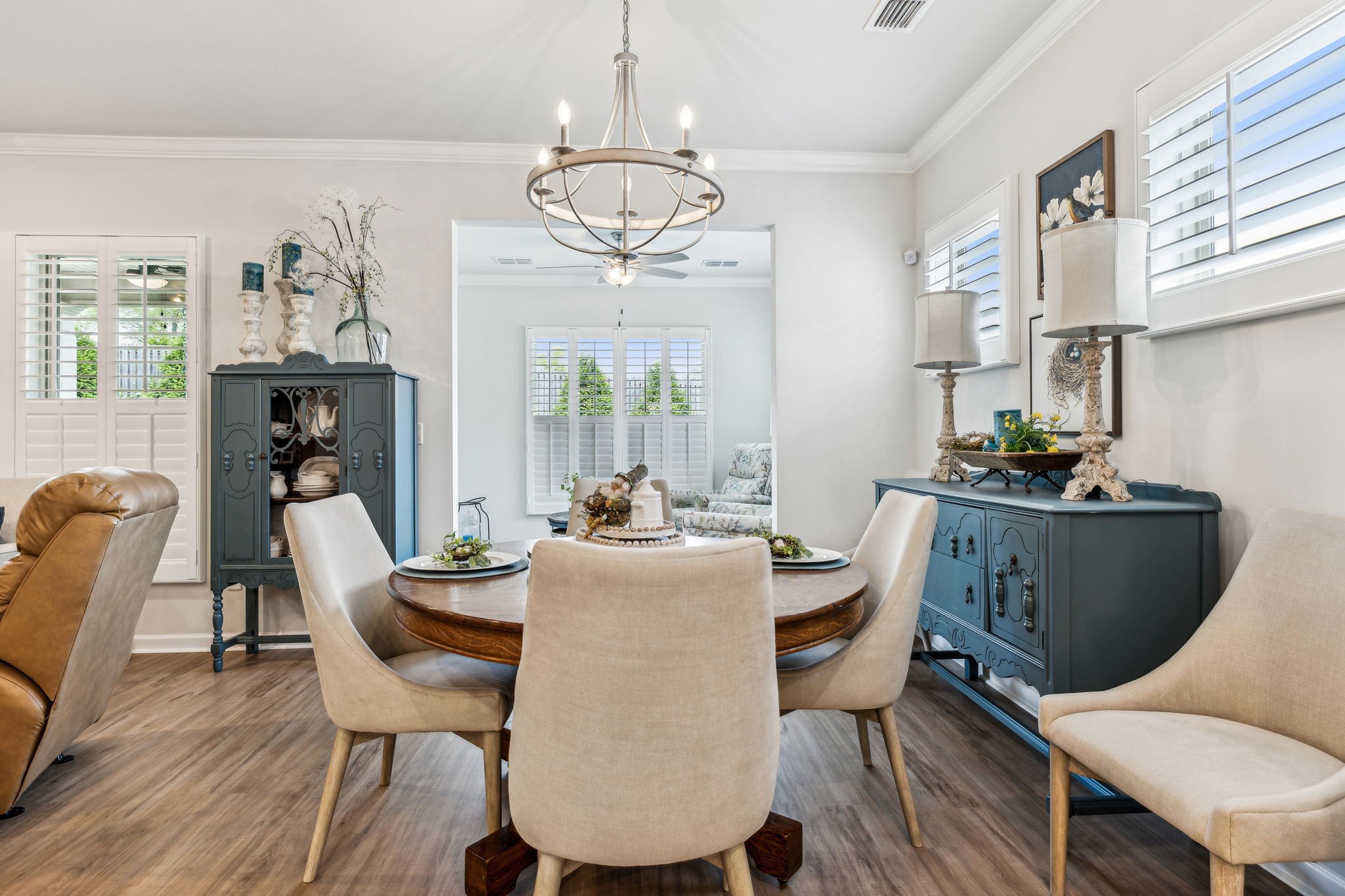 1062 Sumner Grove Spring Hill, TN 37174 - Photo 19 of 44 a dining room with furniture a chandelier and wooden floor