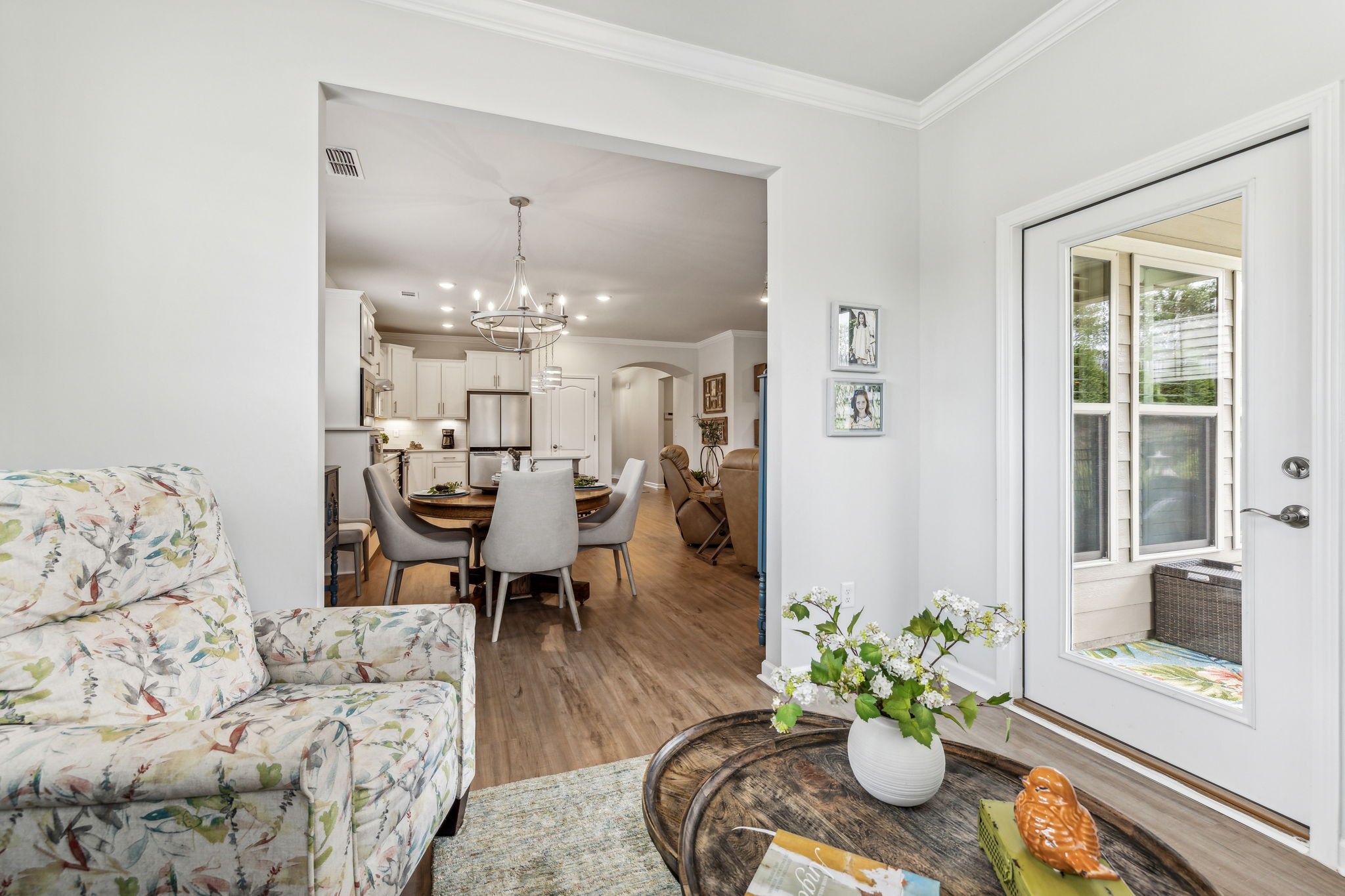 1062 Sumner Grove Spring Hill, TN 37174 - Photo 21 of 44 a living room with furniture and a chandelier