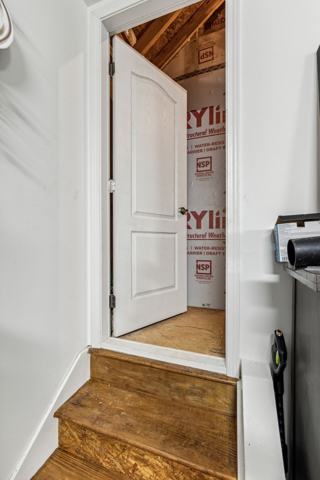 1062 Sumner Grove Spring Hill, TN 37174 - Photo 31 of 44 a view of a refrigerator in kitchen and an empty room