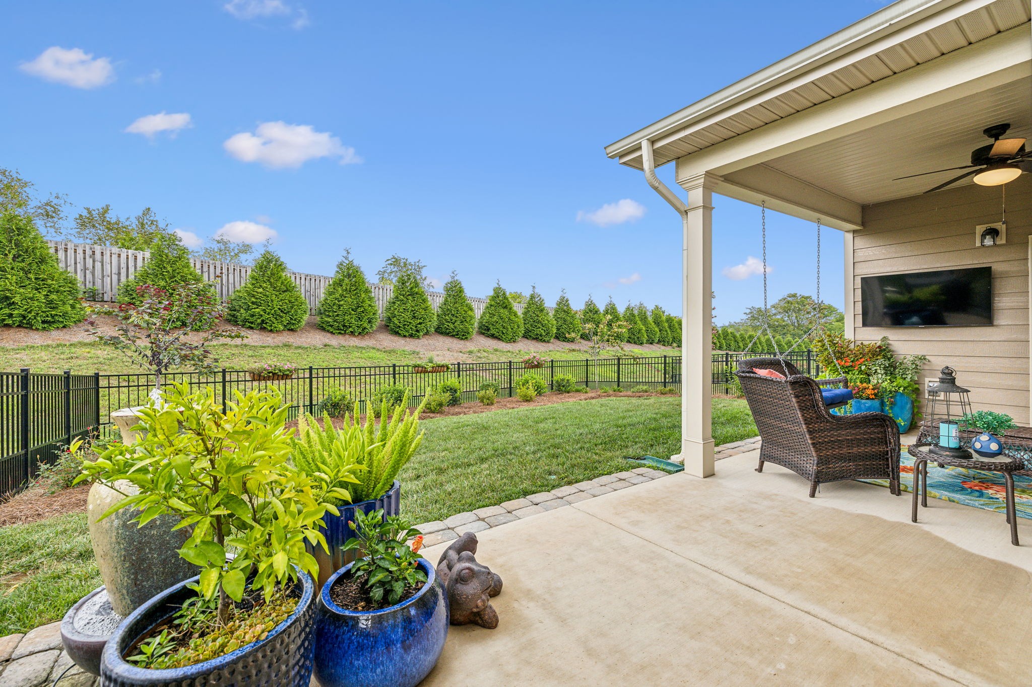 1062 Sumner Grove Spring Hill, TN 37174 - Photo 34 of 44 a front view of a house with garden and sitting area