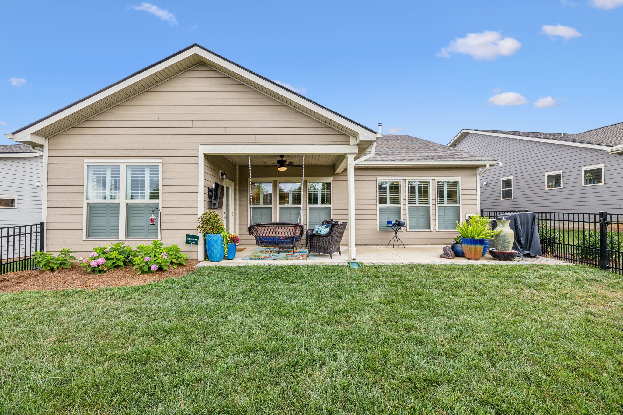 1062 Sumner Grove Spring Hill, TN 37174 - Photo 36 of 44 a view of a house with a backyard porch and sitting area
