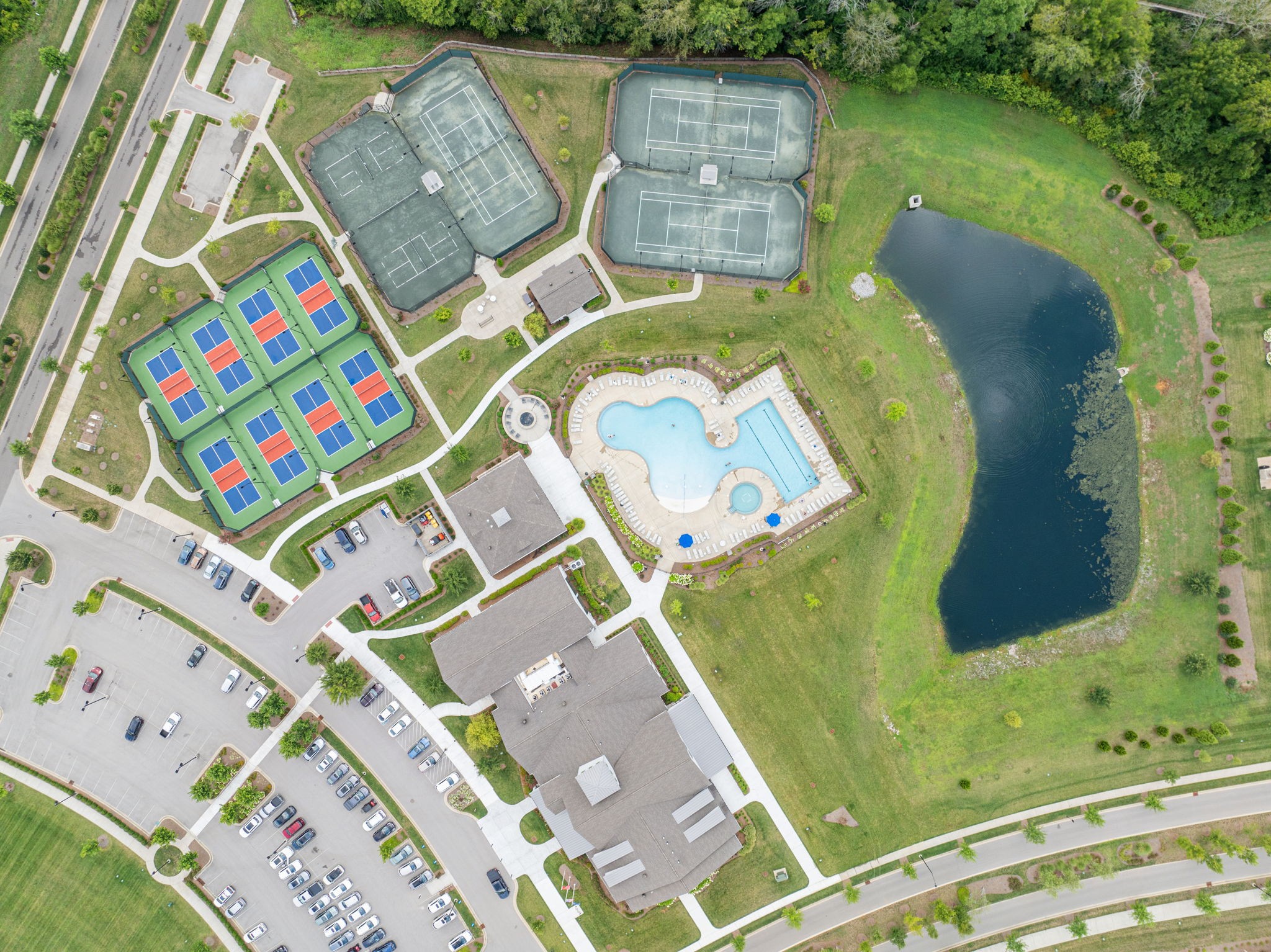 1062 Sumner Grove Spring Hill, TN 37174 - Photo 39 of 44 an aerial view of a house with a garden and swimming pool