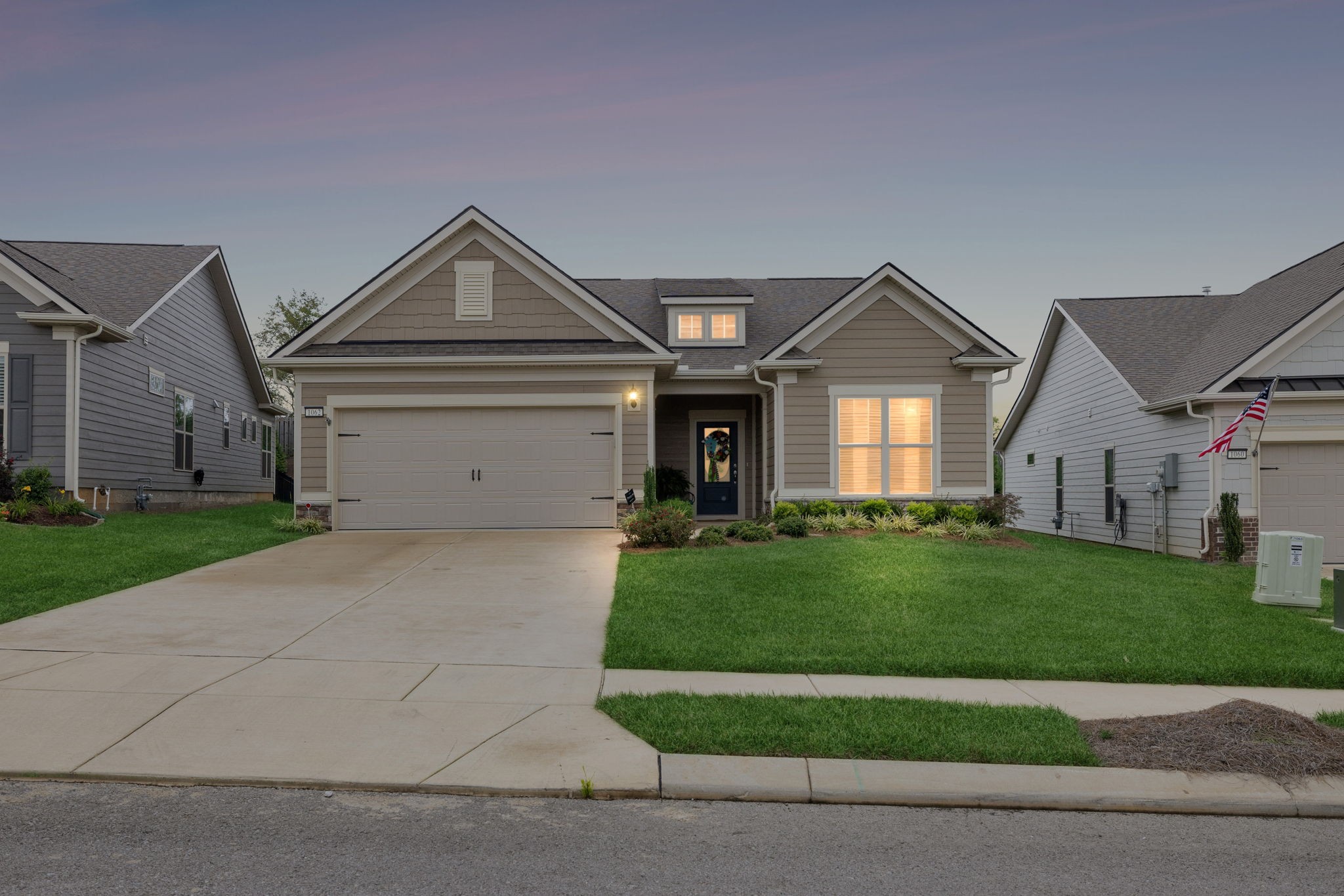 1062 Sumner Grove Spring Hill, TN 37174 - Photo 44 of 44 a front view of a house with a yard and garage
