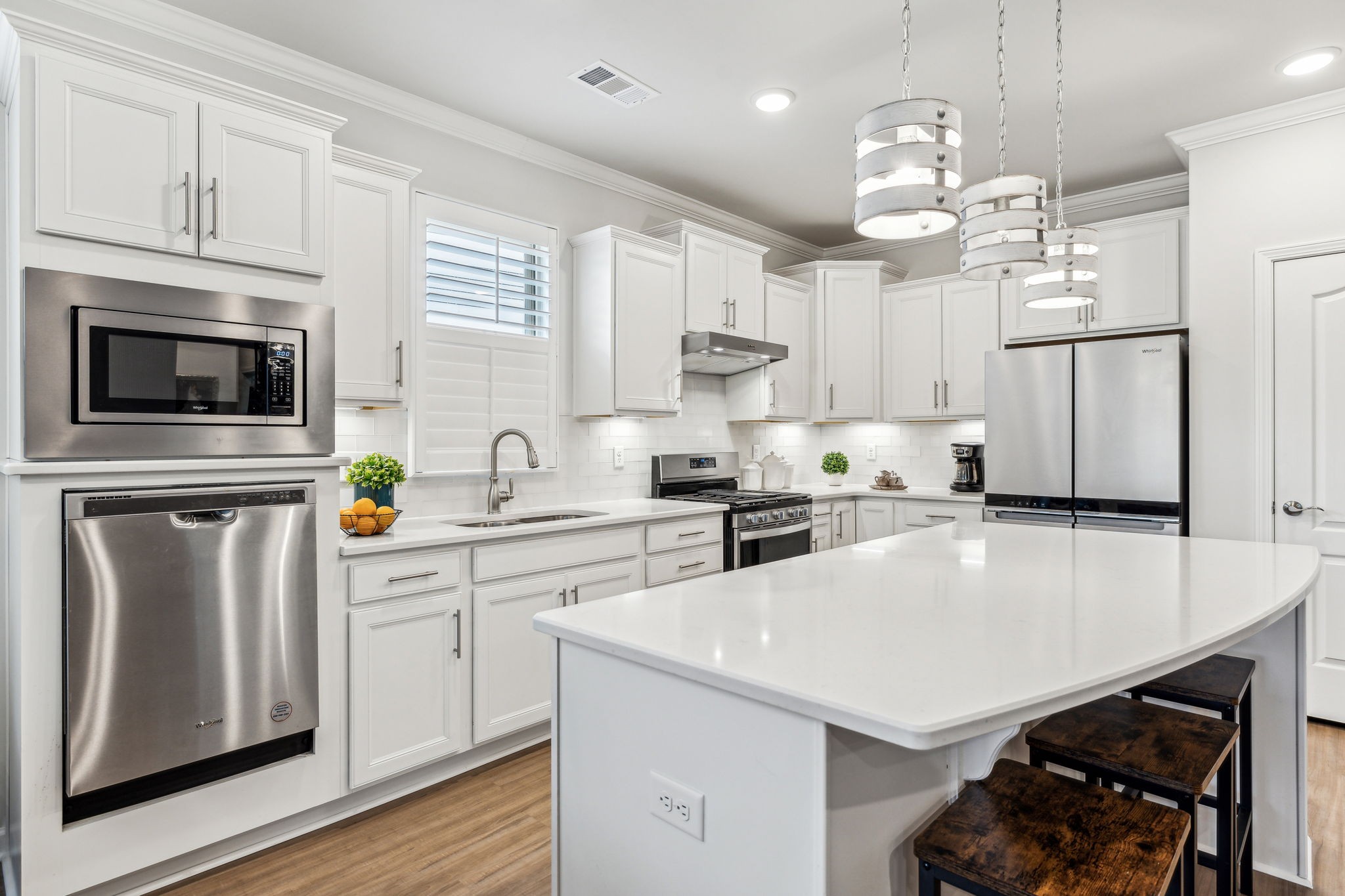 1062 Sumner Grove Spring Hill, TN 37174 - Photo 10 of 44 a kitchen with stainless steel appliances a stove a sink a microwave a refrigerator and cabinets