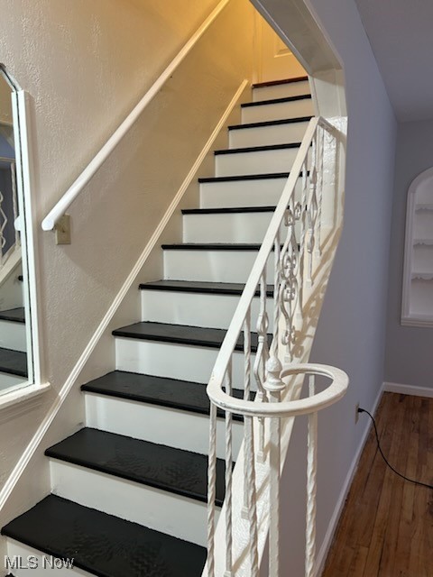 20806 Watson Road Maple Heights, OH 44137 - Photo 2 of 5 Stairway featuring wood finished floors and baseboards