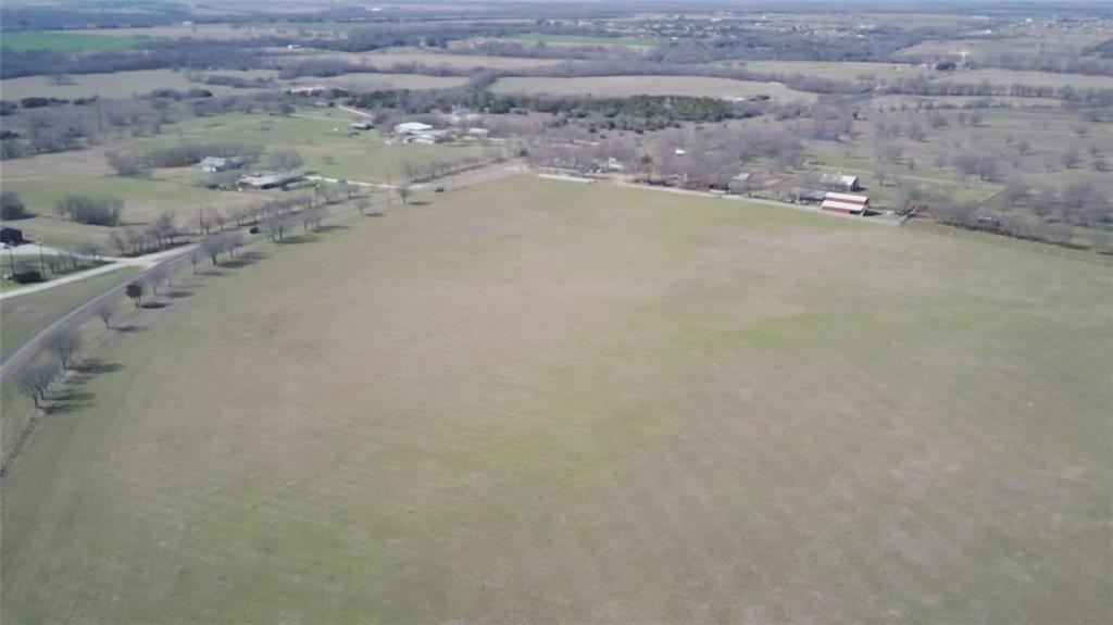 2488 Rio Vista Covington, TX 76636 - Photo 1 of 1 a view of a dry yard with wooden fence