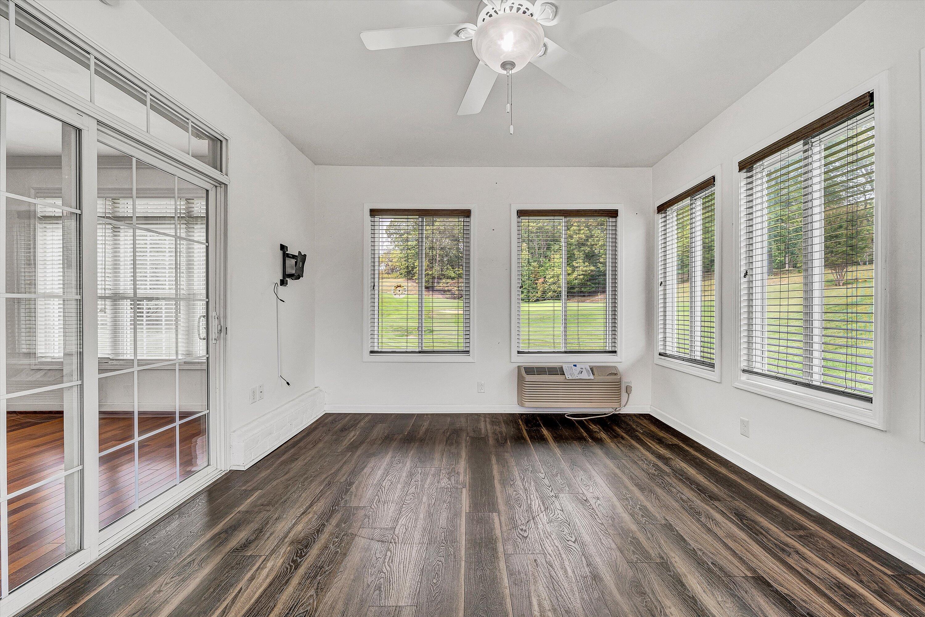 1613 Edgebrook Road Salem, VA 24153 - Photo 18 of 40 an empty room with wooden floor and windows