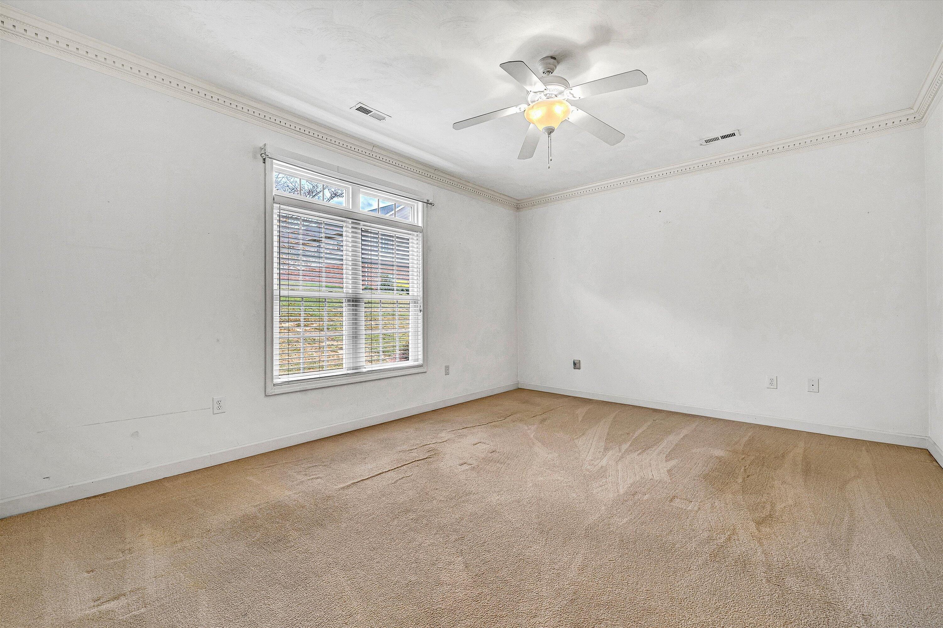 1613 Edgebrook Road Salem, VA 24153 - Photo 21 of 40 an empty room with chandelier fan and windows