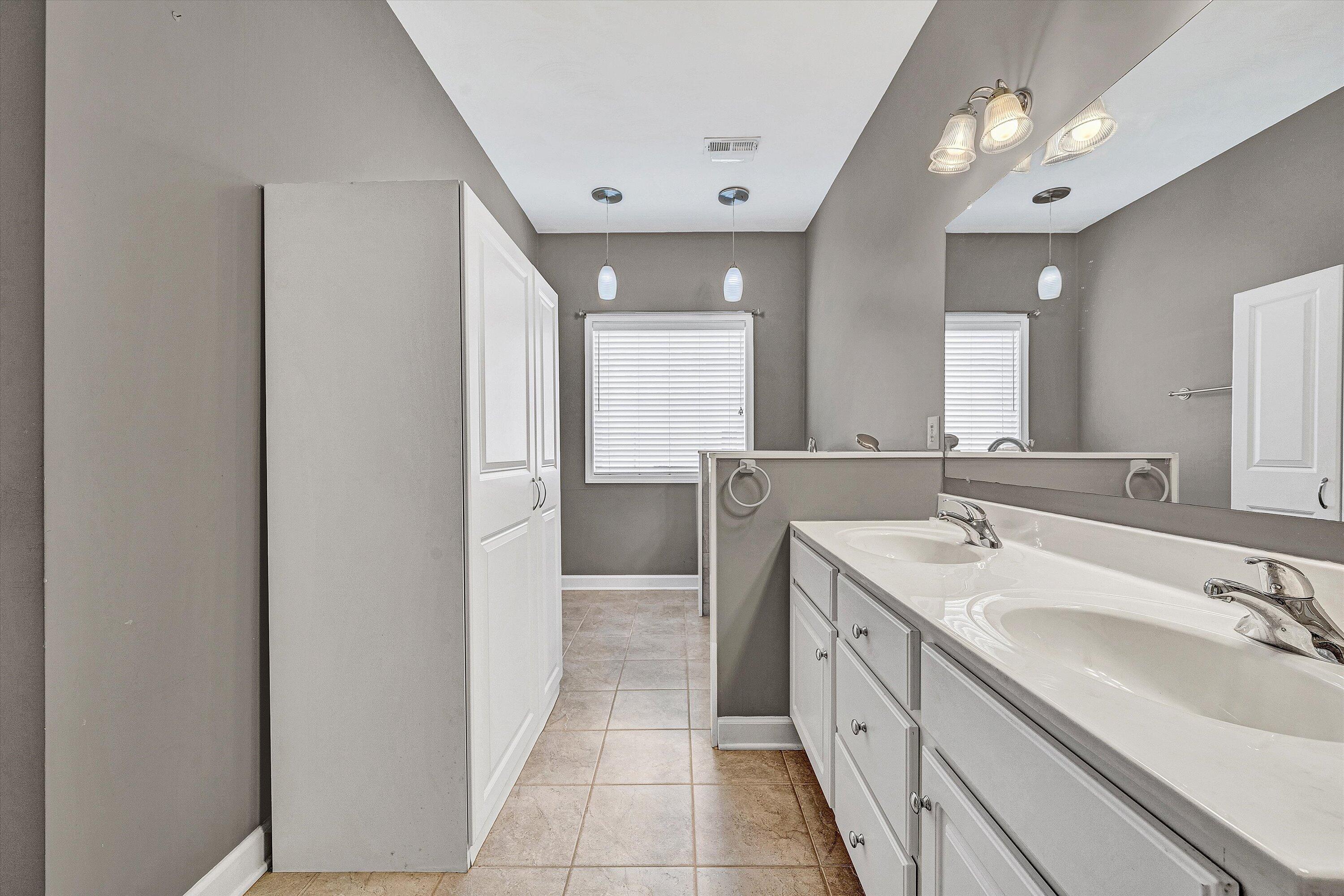 1613 Edgebrook Road Salem, VA 24153 - Photo 24 of 40 a spacious bathroom with a double vanity sink a mirror and a shower