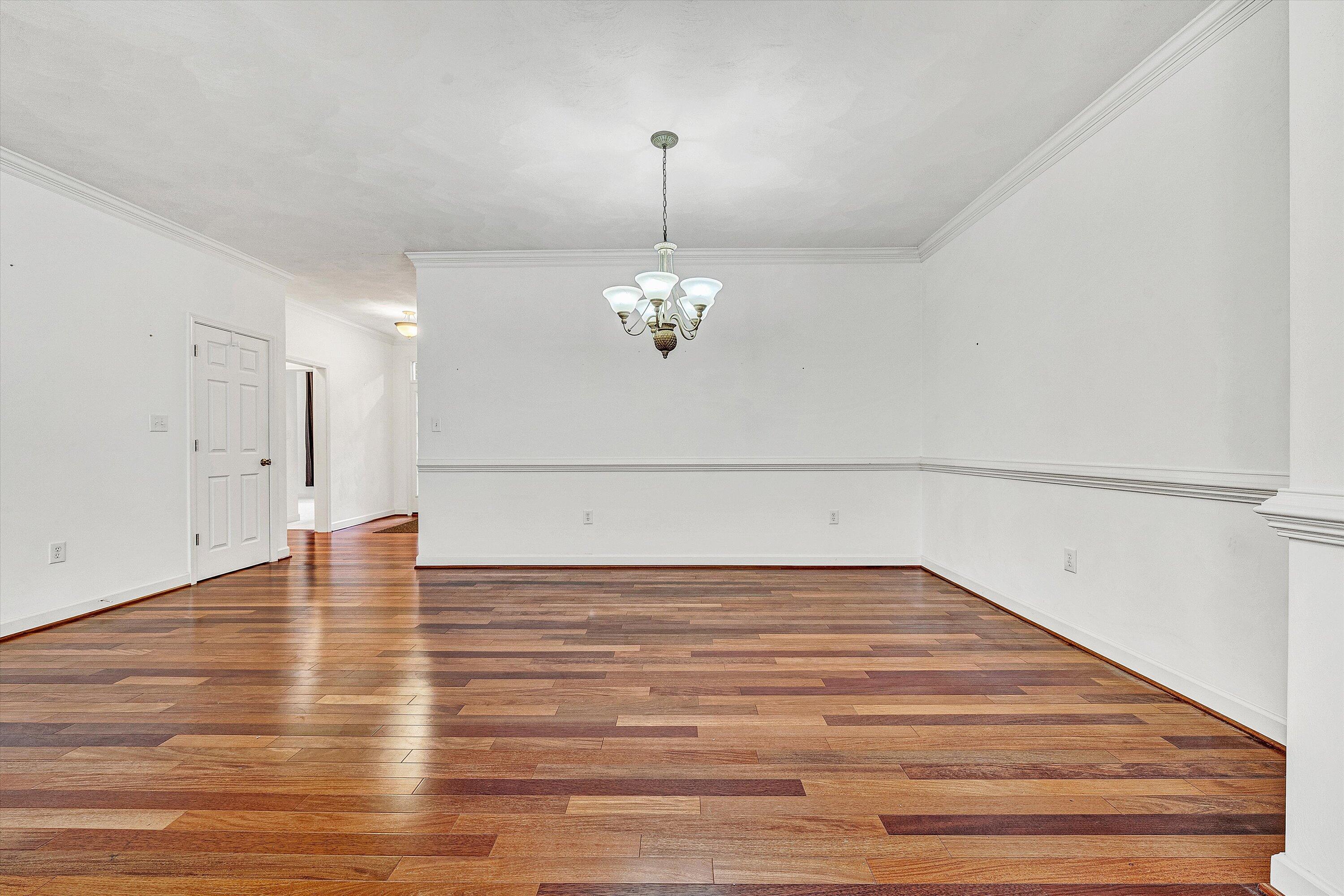 1613 Edgebrook Road Salem, VA 24153 - Photo 6 of 40 a view of a room with wooden floor and chandelier