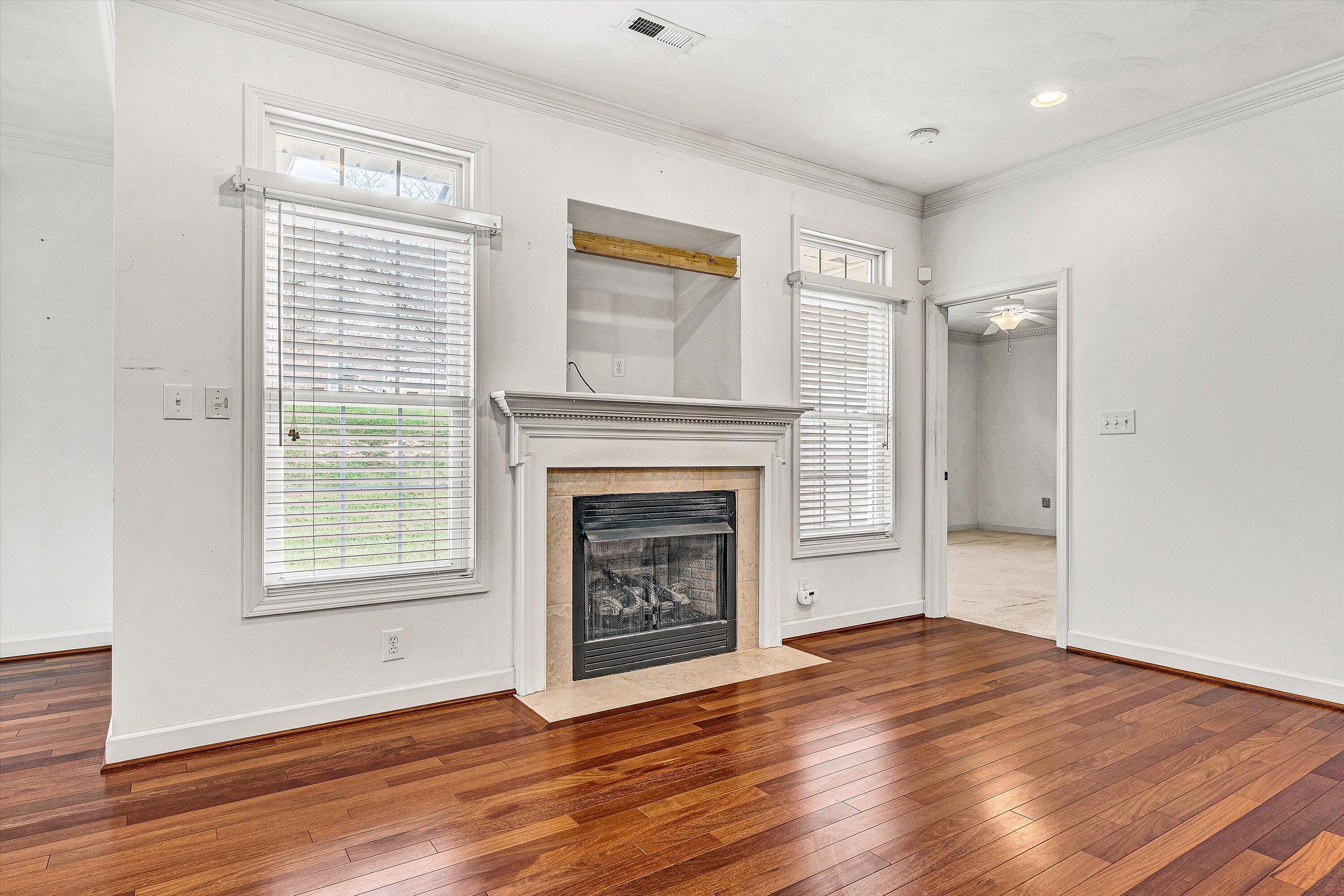 1613 Edgebrook Road Salem, VA 24153 - Photo 7 of 40 a view of an empty room with wooden floor and a window