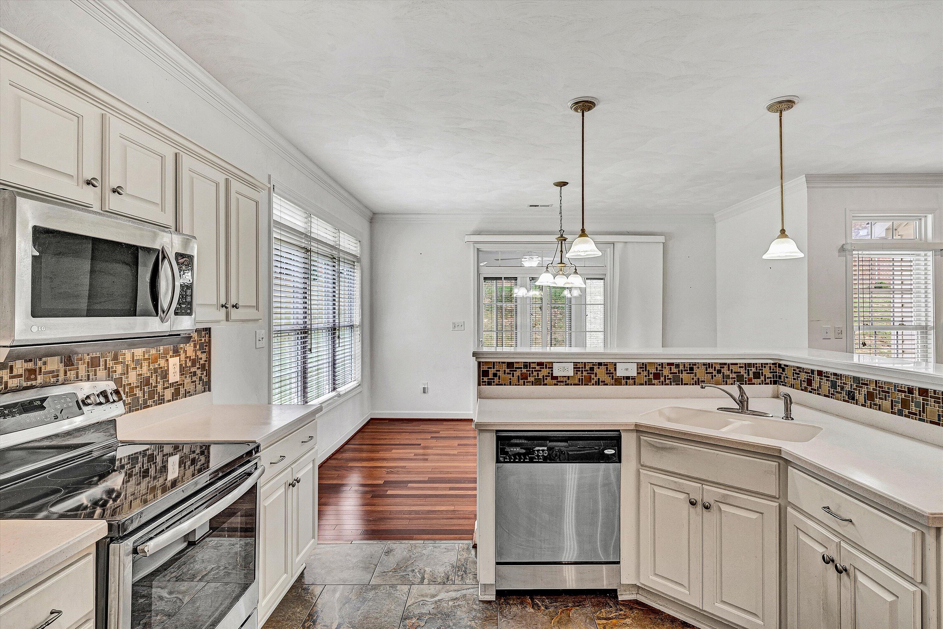 1613 Edgebrook Road Salem, VA 24153 - Photo 9 of 40 a kitchen with sink stove and cabinets