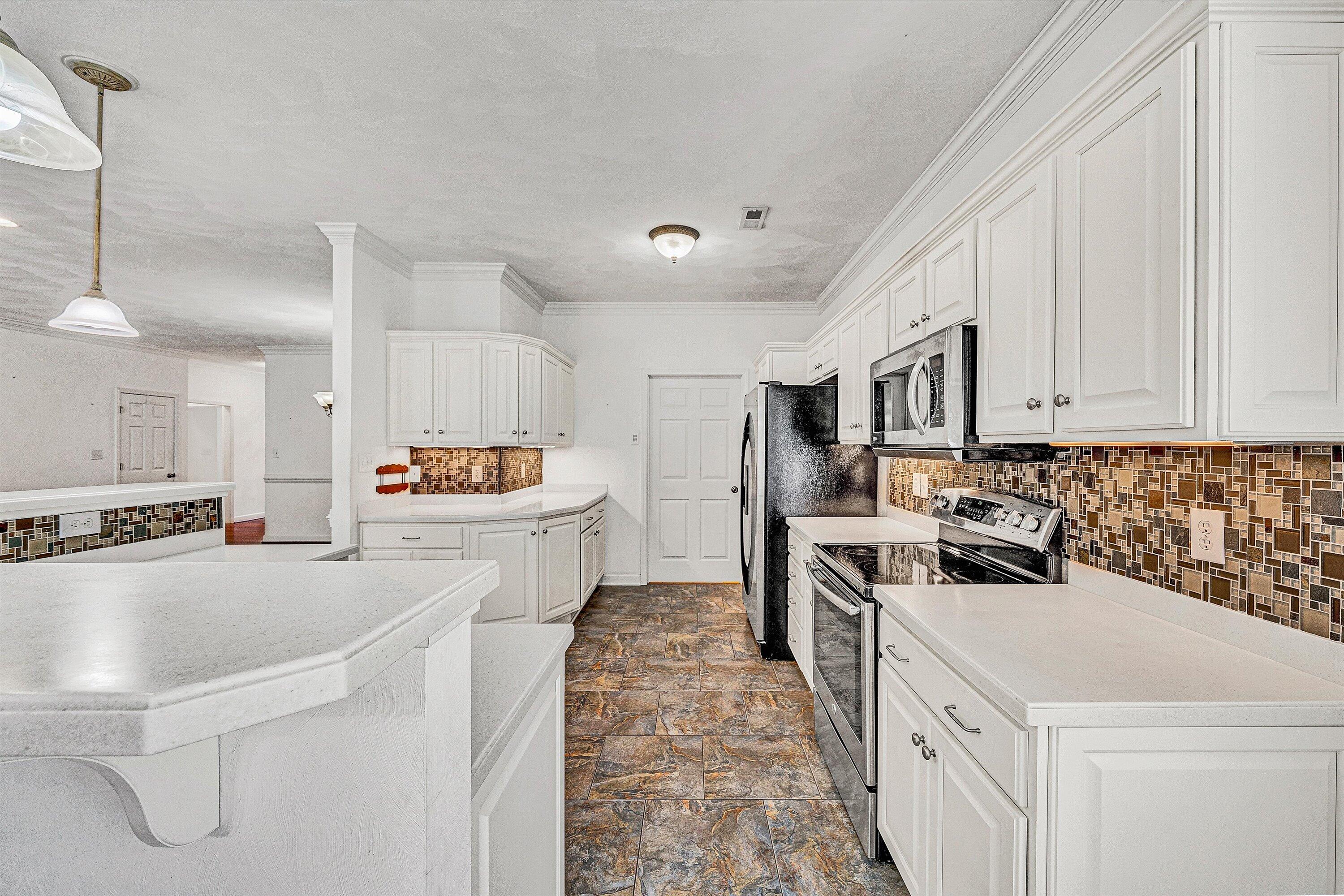 1613 Edgebrook Road Salem, VA 24153 - Photo 10 of 40 a kitchen with cabinets a sink and white appliances