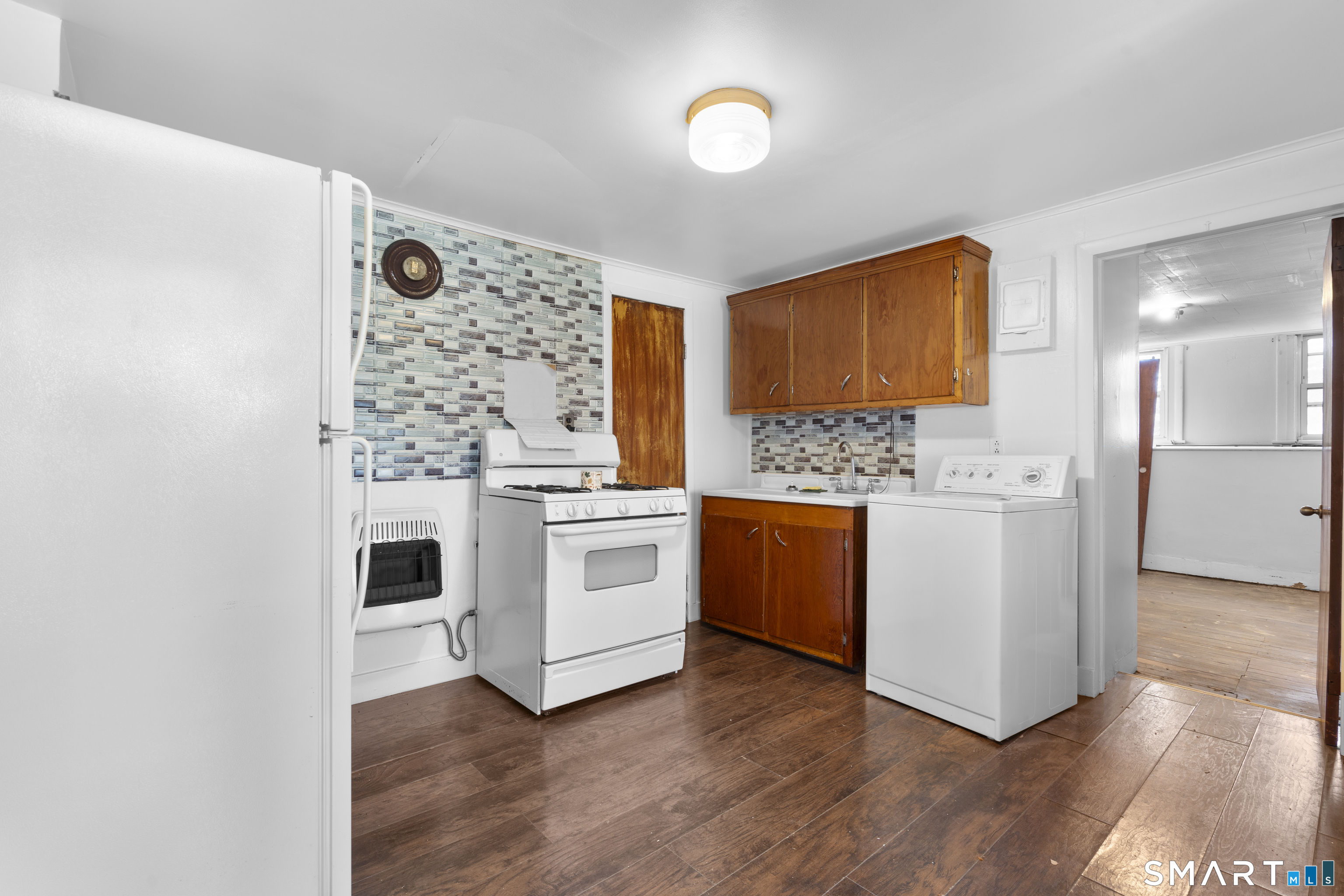 48 Anderson Street, Unit 2 Naugatuck, CT 06770 - Photo 2 of 7 a kitchen with granite countertop white cabinets and white appliances