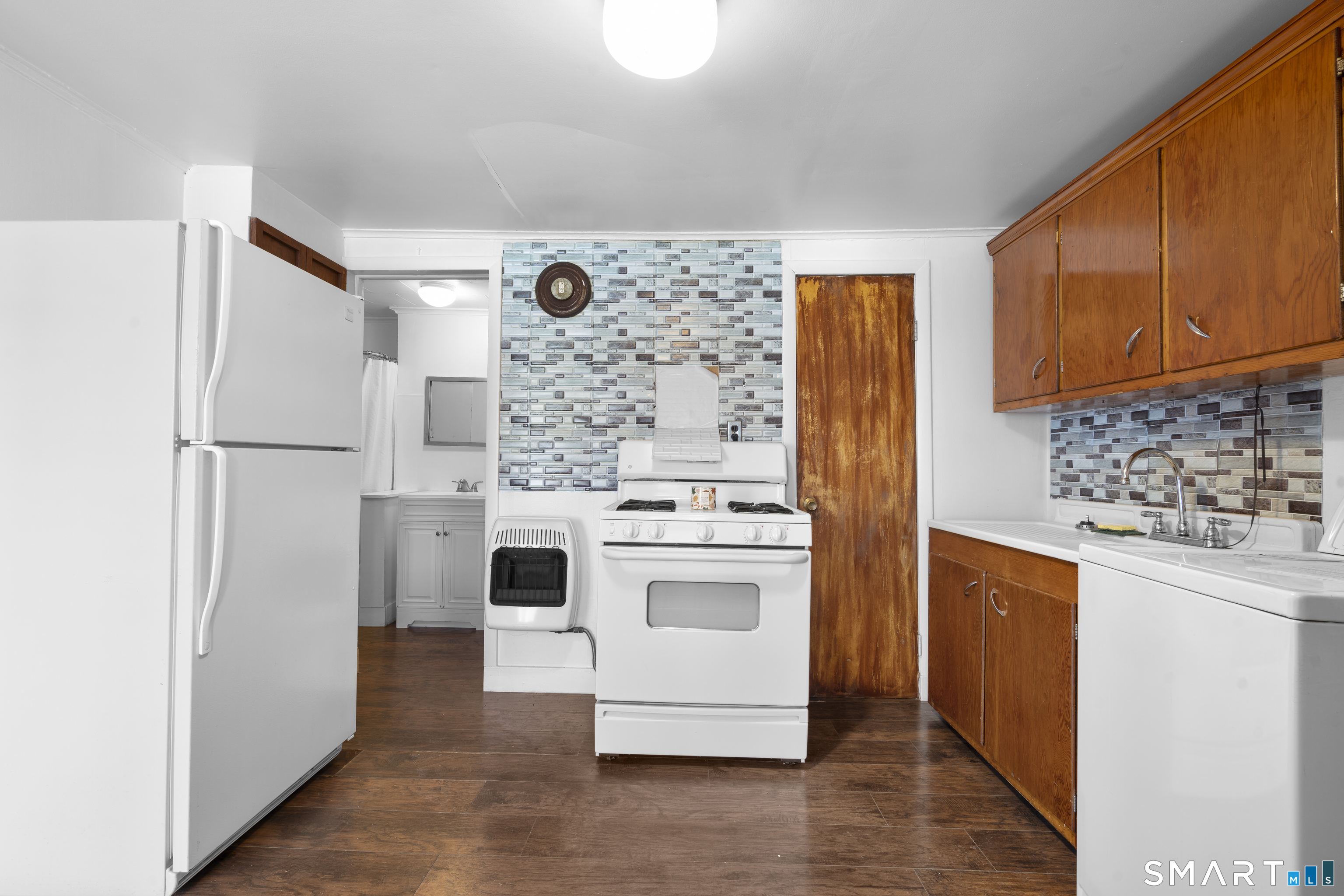 48 Anderson Street, Unit 2 Naugatuck, CT 06770 - Photo 3 of 7 a kitchen with stainless steel appliances a refrigerator and a stove