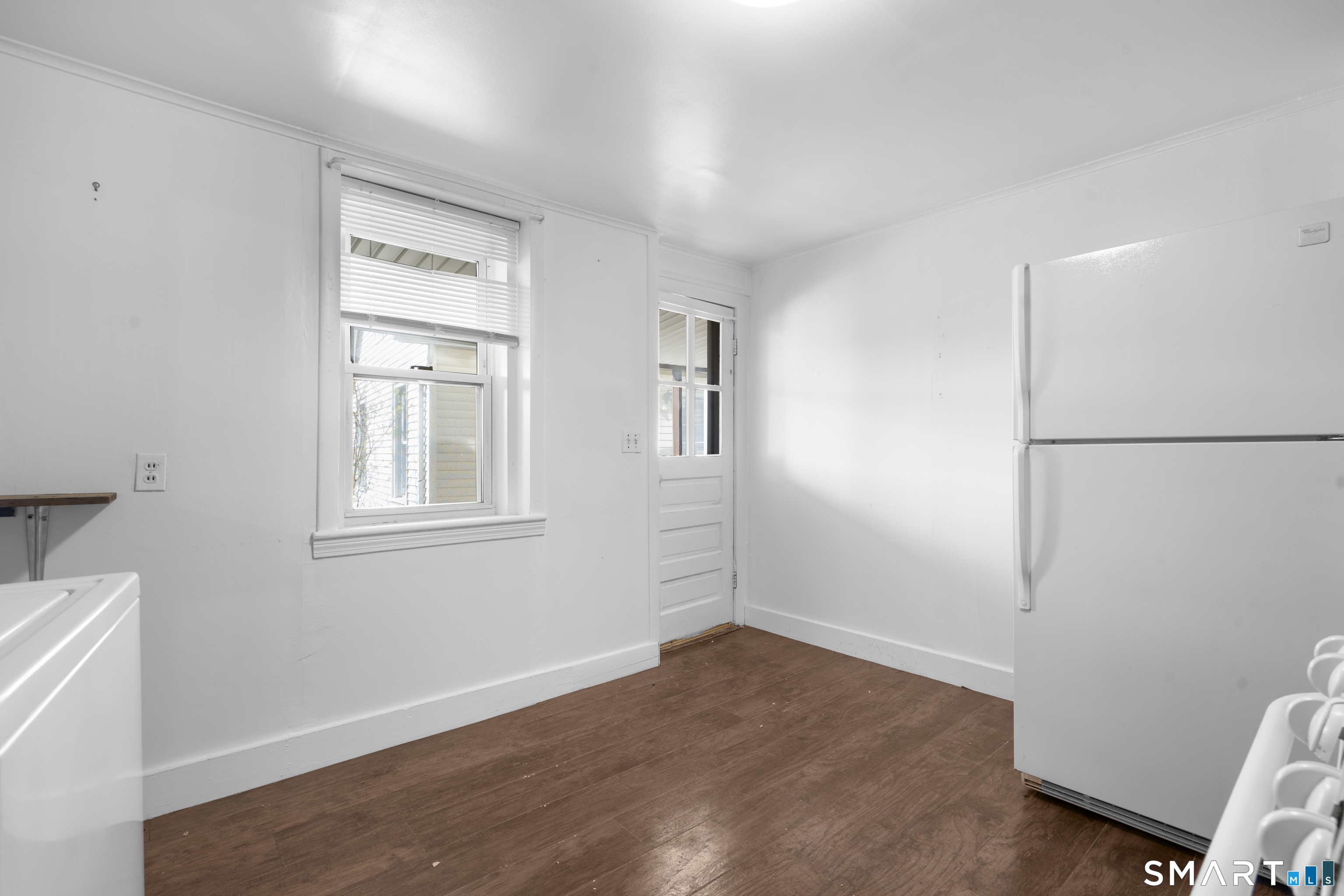 48 Anderson Street, Unit 2 Naugatuck, CT 06770 - Photo 5 of 7 a view of a room that has a window in it