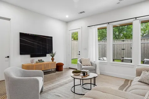 a bedroom with a bed and a table