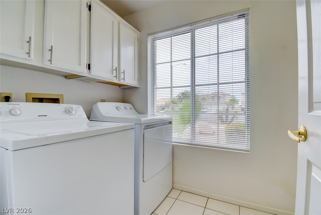 5 Tarryall Terrace Henderson, NV 89074 - Photo 10 of 44 Functional laundry space featuring convenient upper cabinetry and natural illumination.