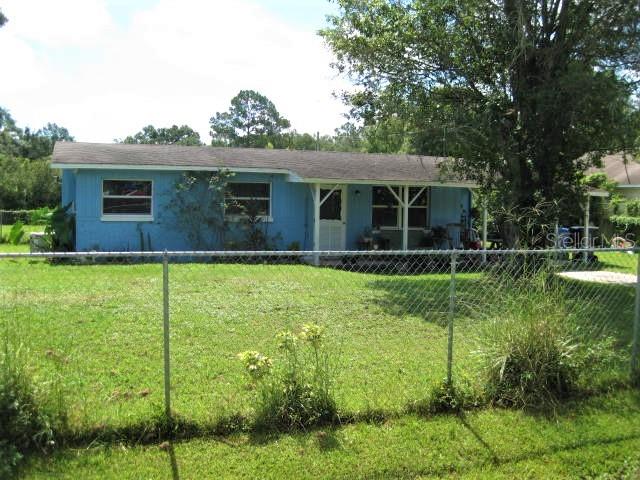 10713 McIntosh Road Thonotosassa, FL 33592 - Photo 1 of 1 a view of a house with backyard