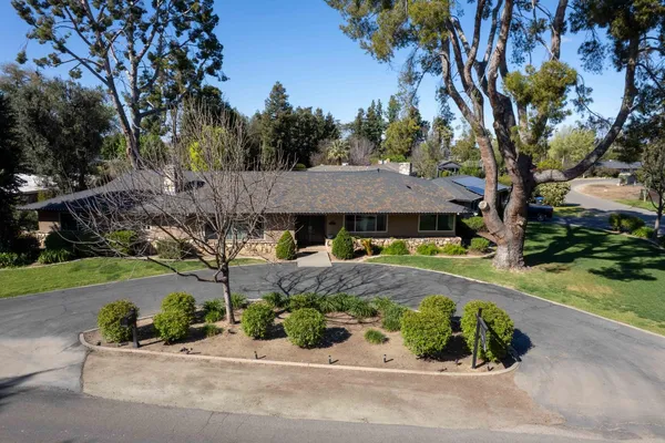 front view of a house with a small yard