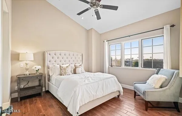 a bedroom with a bed and a couch